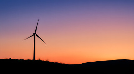 Obraz premium Wind turbine against sunset sky, symbolizing clean energy and sustainable future
