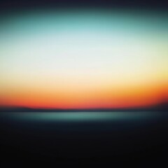 Fototapeta premium Gradient Sunset Over Water: Blurred Horizon with Warm and Cool Tones