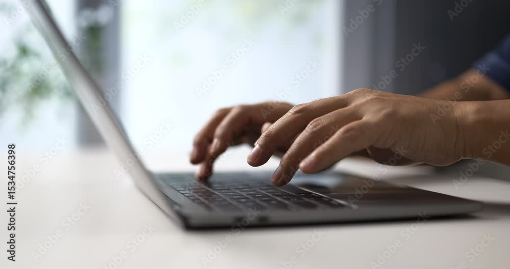 Fototapete hands typing on keyboard in minimal workspace