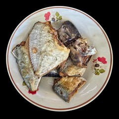 fried tilapia fish on white dish