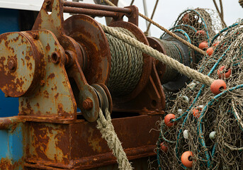 Rusty fishing winch and nets detail