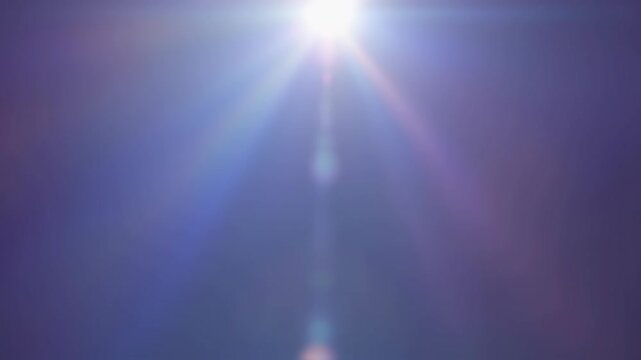 A radiant, soft purple glow emanates from a central light source with subtle rainbow diffraction and vertical beams, creating a dreamy, ethereal effect.