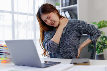 Portrait of business asian woman feeling neck pain in office, stress, depression and burnout...