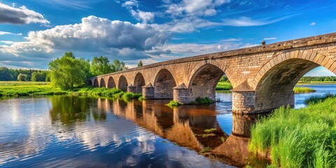 Fototapeta premium Ancient stone bridge over Kama River in Kambarka Udmurtia Russia