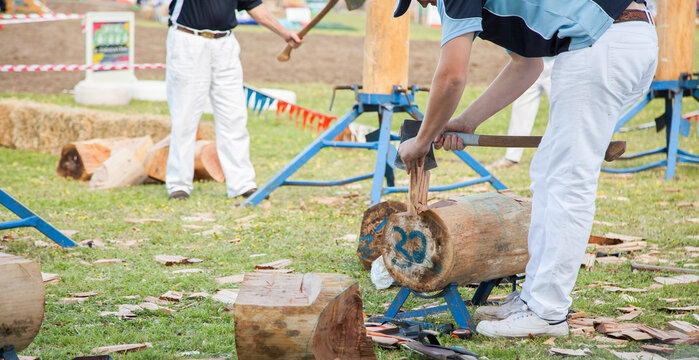 Man preparing block for wood splitting competition