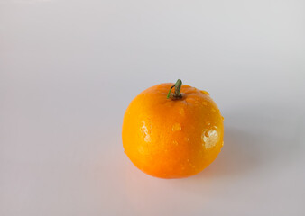 dewy orange with water droplets, beautifully isolated on a clean white background, perfect for showcasing freshness, health, and natural beauty.