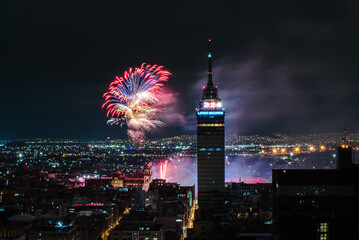 Independence Day Fireworks and light show over Zocalo with Torre Latinoamericana and Palacio de Bellas Artes, Mexico City