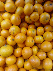 stunning close-up shot of a number of fresh, ripe oranges, showing off their bright color and textured skin, perfect for healthy eating