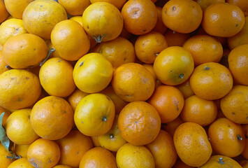 stunning close-up shot of a number of fresh, ripe oranges, showing off their bright color and textured skin, perfect for healthy eating