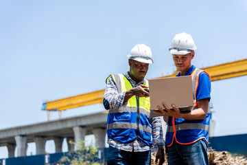 Engineers Discussing Project Progress at Construction Site, Multi-ethnic Team Collaborating on Rail Project, Construction Workers Planning Infrastructure Development