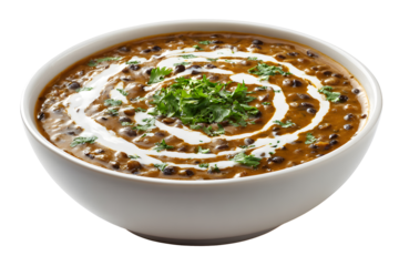 Traditional Indian dal makhani served in white bowl garnished with cream and fresh coriander leaves isolated on transparent background