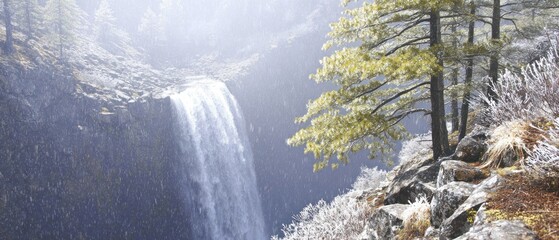 Majestic waterfall cascading down a misty mountain