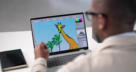 Young African American Man Edits Colorful Graphic Designs