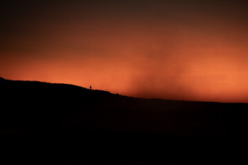 Volcanic ledge, tiny distant soul - 3