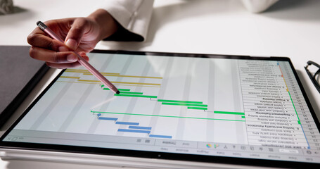 Businesswoman Analyzing Data Chart On Laptop