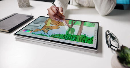 African-American Woman Creating Digital Art On Tablet