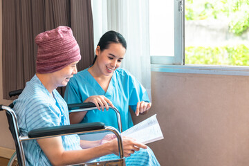 Cancer man patients in wheelchairs receive rehabilitation treatment at clinic. Young female doctor medical therapy treatments.Young patient with a smiling and friendly expression.