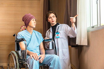 Cancer man patients in wheelchairs receive rehabilitation treatment at clinic. Young female doctor medical therapy treatments.Young patient with a smiling and friendly expression.