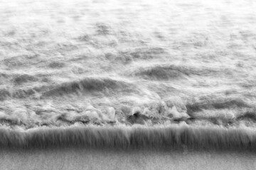 Monochrome water pulls from shore