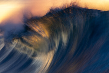 Textured sea glows with fire