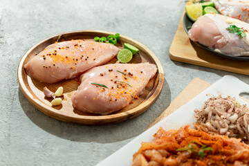 Marinated chicken breast ready for grilling.
