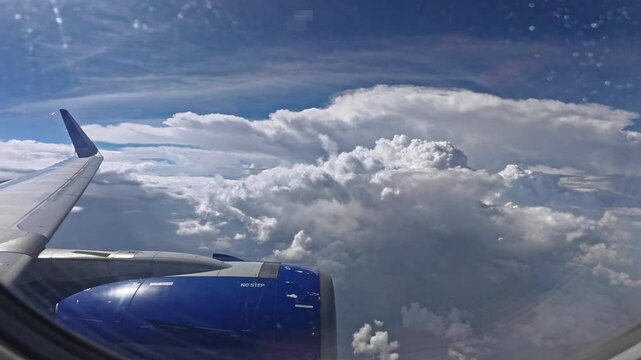 Airplane flying above the clouds from airplane window. Flight take off & Flight landing at International airport, airport terminals, airport passenger gates. airbus a320. flight travel experiences.
