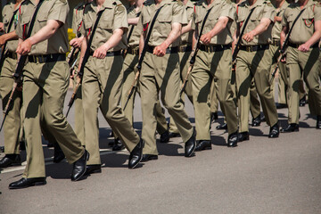 Soldiers marching down the road
