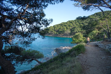 Senior women walking along the sea shore