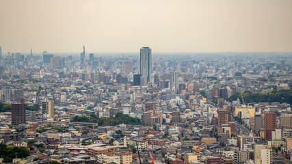 Nagoya cityscape seen from Higashiyama Tower on a clear day.Cityscape of Nagoya city overlooking from the sunny Higashiyama Tower.