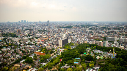 Obraz premium Nagoya cityscape seen from Higashiyama Tower on a clear day.Cityscape of Nagoya city overlooking from the sunny Higashiyama Tower.