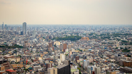 Nagoya cityscape seen from Higashiyama Tower on a clear day.Cityscape of Nagoya city overlooking from the sunny Higashiyama Tower.