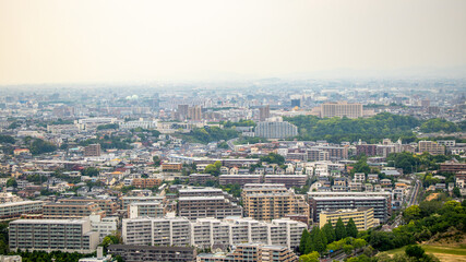 Nagoya cityscape seen from Higashiyama Tower on a clear day.Cityscape of Nagoya city overlooking from the sunny Higashiyama Tower.