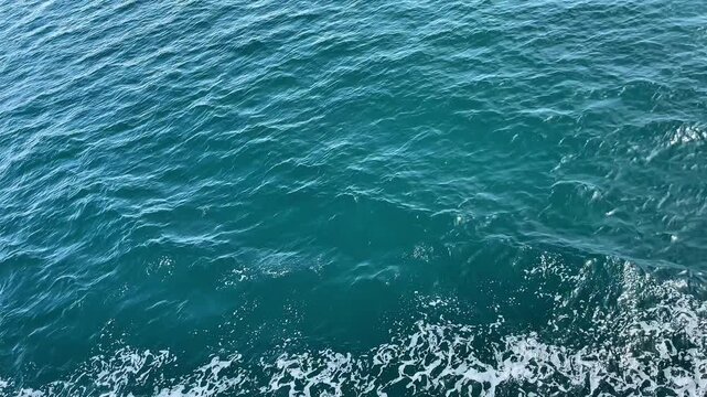 Clear Blue Sea Waves Created by Moving Ship &ndash; Vertical Footage of Ocean Wake