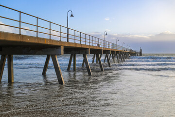 Obraz premium Glenelg jetty, Adelaide South Australia, beach coastal tourism landmark