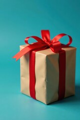 Obraz premium Zero waste Christmas presents Brown paper, red bow, blue backdrop , gift wrapping, present, holiday