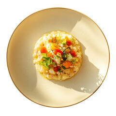 Creamy risotto dish with fresh vegetable topping and herbs