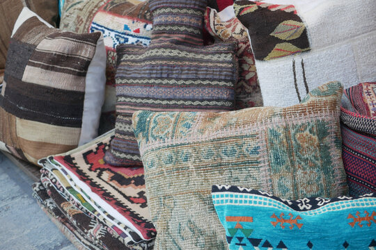 Vibrant handmade cushions and textiles available - Powered by Adobe