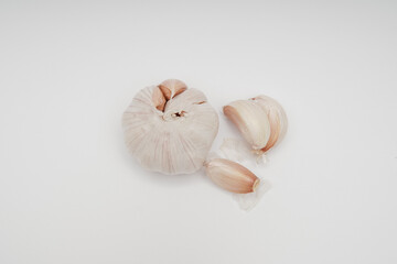 Minimalist food photography of garlic bulb and cloves for recipe websites culinary blogs or nutritional content food photography still life style