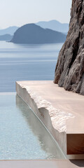 Serene infinity pool overlooking calm ocean waters and rocky cliffs in a tranquil setting