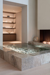 Elegant indoor space with minimalist design and tranquil water feature near fireplace