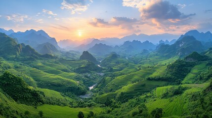 Obraz premium Panoramic mountain vista at sunset. Lush green rice paddies cascade down hills