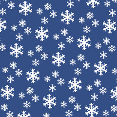 Delicate white snowflakes of various sizes fall against a soft light blue background, evoking a peaceful winter ambiance and a sense of tranquility.