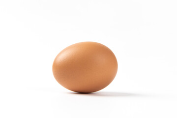 brown raw chicken egg isolated on white background