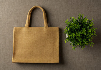 Beige jute tote bag with small green plant
