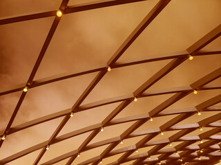 A beautifully designed ceiling with a geometric pattern and lights