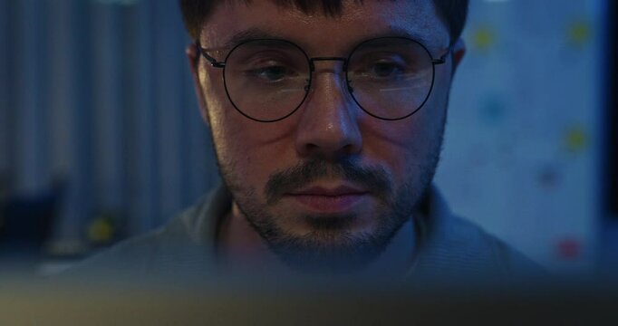 Closeup team adult male freelance work late typing write prompt AI bot app program nomad terminal code at office night. Artificial intelligence dashboard, robotics, user interface, machine learning.