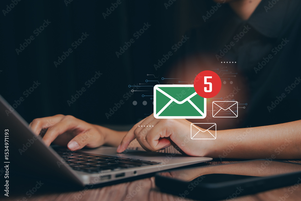 Poster email concept. hands typing on a laptop with digital email notifications for communication and produ