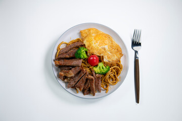 Steak pasta with fried egg meal