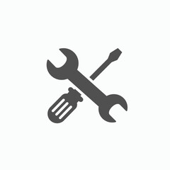 A gray wrench and screwdriver are crossed in the center of a white background