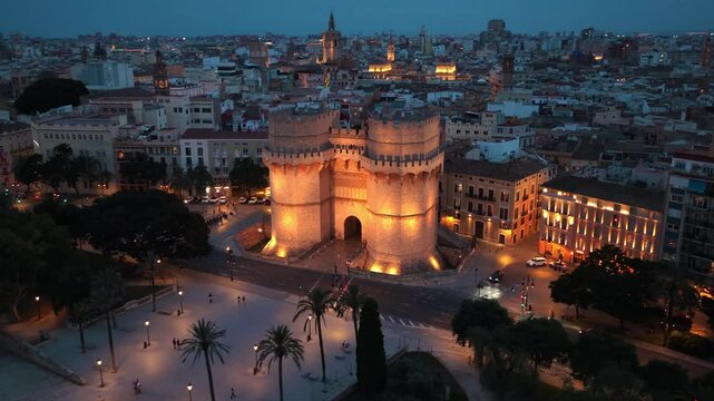 night drone view of Valencia, Torres de Serranos in Valencia at night with illumination, tourism in Valencia, Spain, Spanish travel destination in Catalunya